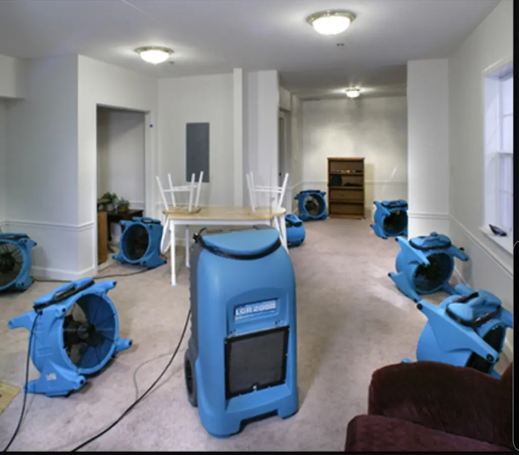 Air movers and dehumidifier setup for Water Damage Restoration in Aston